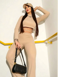Conjunto Feminino Cropped Costas Nua Com Amarração Manga Longa E Calça Flare Cós Alto